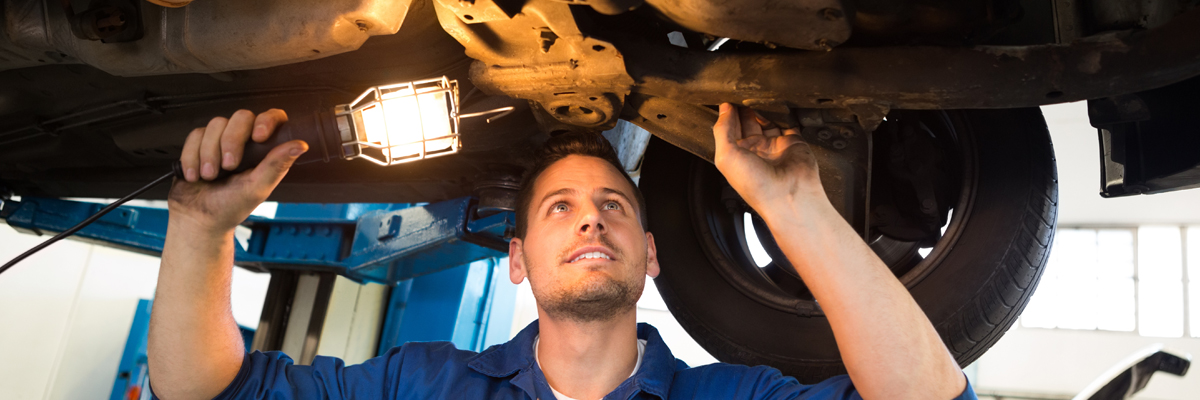 Mechanic servicing a vehicle - Car Service Long Eaton